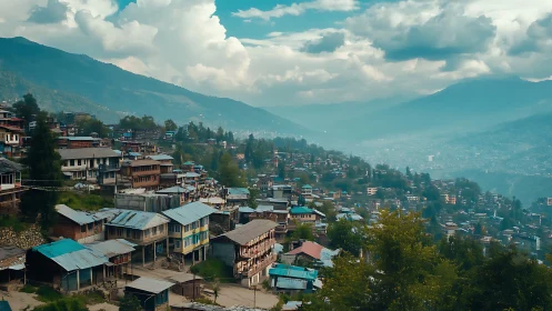 Terraced hillside town under moody clouds and misty ranges.