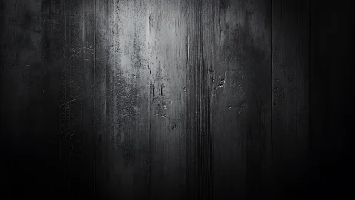 Matte black wooden planks with cinematic side lighting texture.