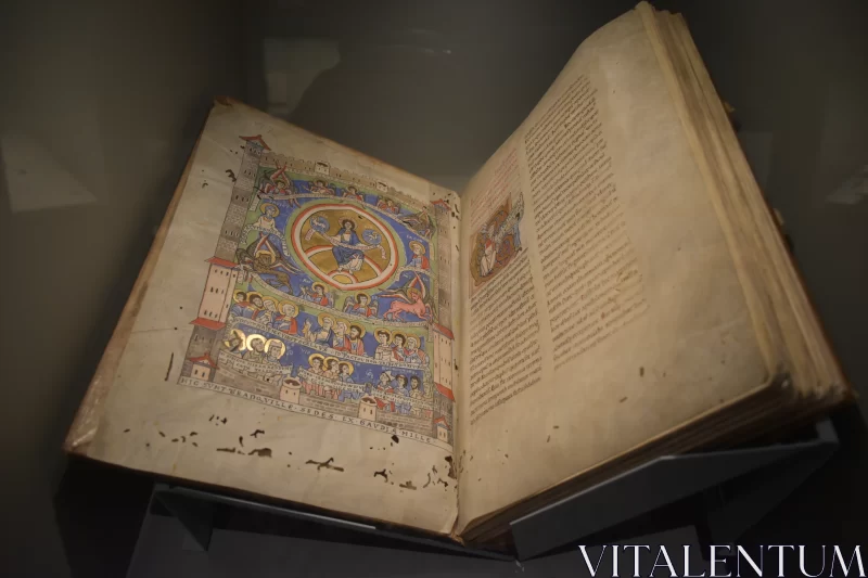 Divine Illumination: Medieval Religious Book Adorned in Paint Free Stock Photo