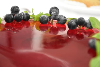 Homegrown Grapes on a Glossy Surface of a Jelly-Curd Cake Free Stock Photo