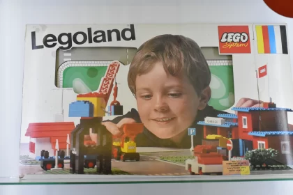Building Dreams: Legoland Box with a Boy's Joyful Lego Play