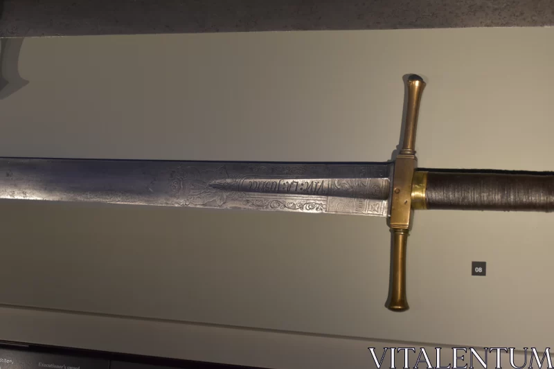 Forged Majesty: Medieval Metal Sword with Filigree Carvings on National Museum Display Free Stock Photo