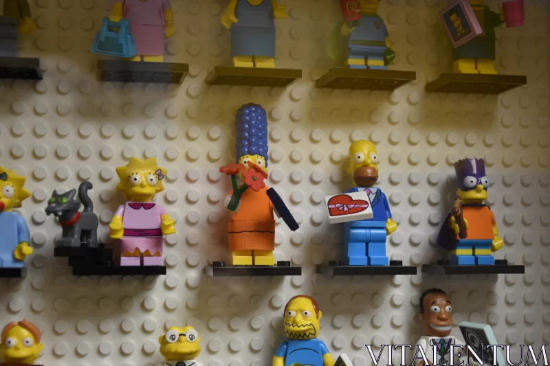Springfield Chronicles: Lego Minifigurines of Beloved Simpson Family on White Lego Wall Free Stock Photo