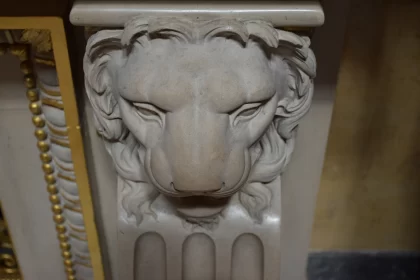 Guardian's Embrace: Stone Lion Barrelief on Column