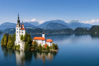 Enchanting Serenity: A Majestic Tapestry of Lake Bled, Pilgrimage Church, and Bled Castle Against th