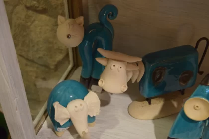 Ceramic Animal Figurines on Shelf - Rural Life Art