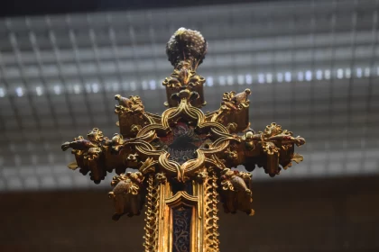 Golden Cross with Ornate Decoration: A Dark Foreboding Close-up
