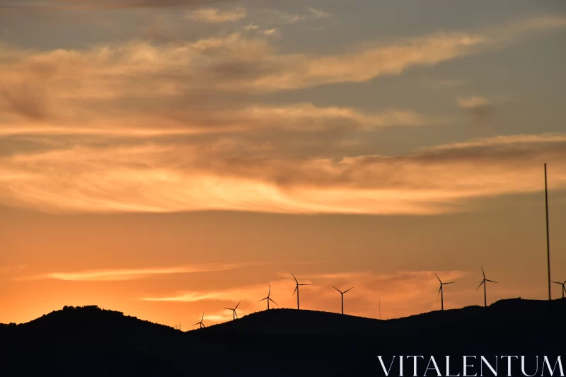 Sunset over Windmill-filled Hills: A Harmony of Nature and Technology Free Stock Photo