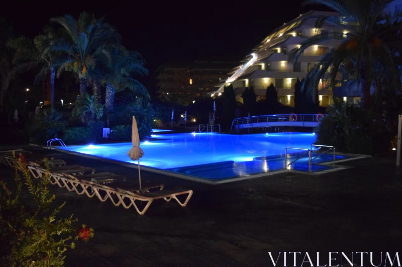Luxurious Resort Pool Illuminated at Night: A Contemporary Turkish Art Piece Free Stock Photo