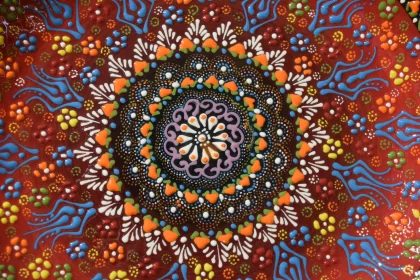 Colorful Mandala Textiles Display with Whimsical Ceramics