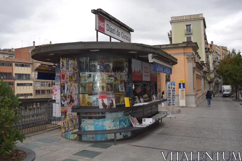 Urban Still Life: Newspaper Stand and Red Sign Free Stock Photo