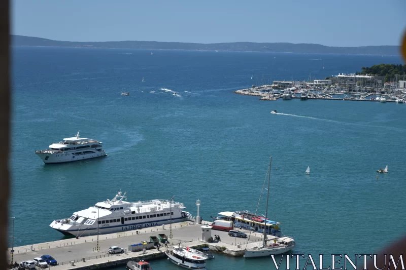 Aerial View of Marina with Docked Boats - Serene Seaside Scenery Free Stock Photo