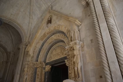 Intricate Stone Cathedral Entrance with Marble Sculpture