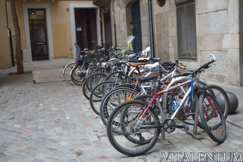 Monochrome Bicycles on Red Street: An Urban Baroque Scene Free Stock Photo