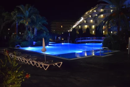 Luxurious Resort Pool Illuminated at Night: A Contemporary Turkish Art Piece