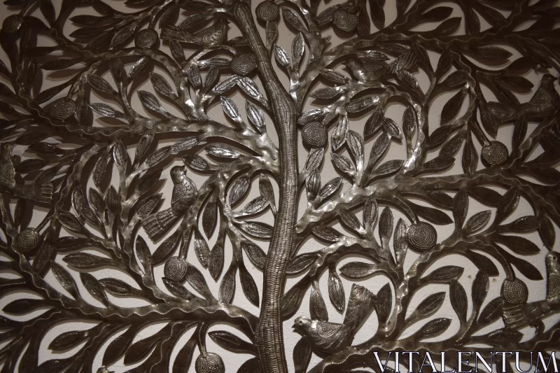 Intricate Metal Tree Wall Art with Naturalistic Bird Portraits Free Stock Photo
