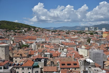 Romanesque Cityscape: Silver and Brown Hues on Red Roofs
