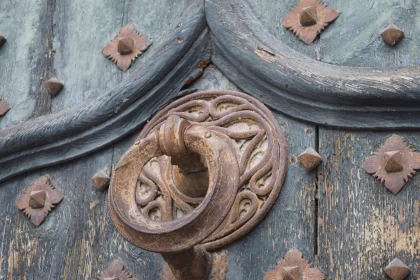 Ornate Door Ring on Wooden Door - A Touch of Norwegian Nature