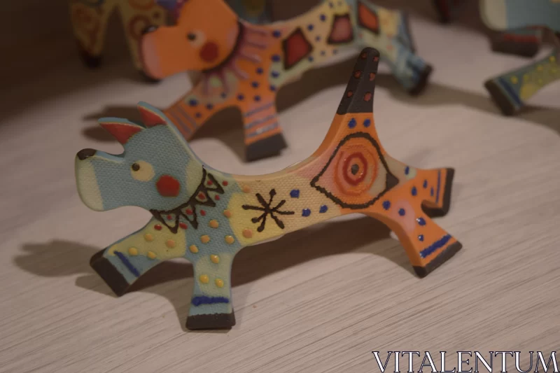 Colorful Painted Wooden Dog Figurines - A Display of Abstract Art Free Stock Photo