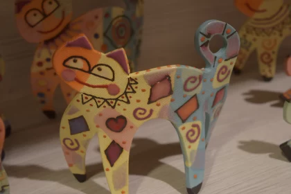 Colorful Handmade Cat Figurines in Artistic Display