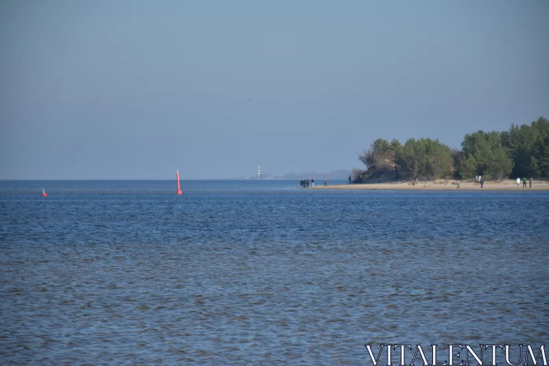 Serene Beach Scene with Sailboat and Kite Free Stock Photo