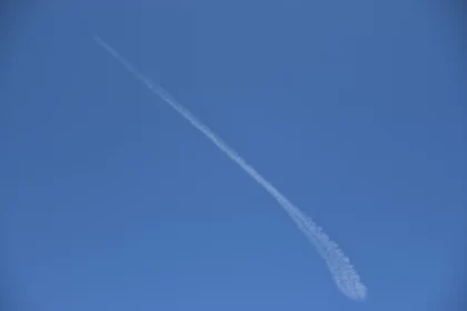 White Contrail in Blue Sky: A Study in Environmental Awareness