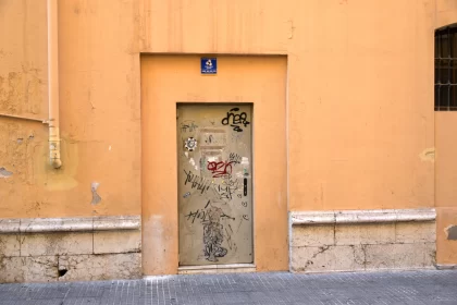 Graffiti Door in Barcelona: A Glimpse into Urban Spain Free Stock Photo
