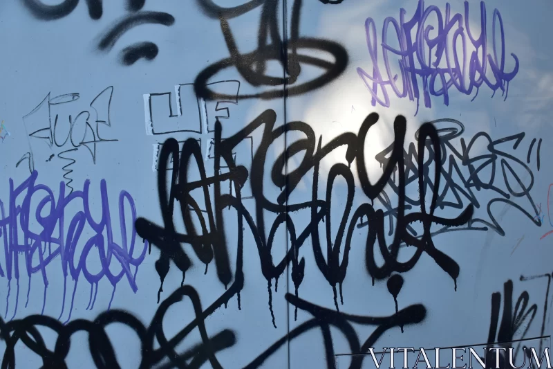 Monochrome Graffiti on Urban Wall: An Artistic Display Free Stock Photo