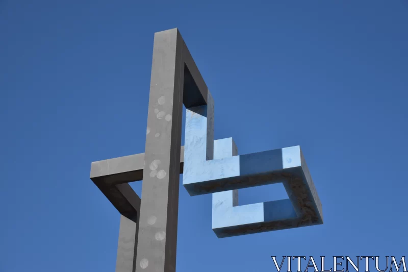 Metal Sculpture with Biblical Iconography Against Blue Sky Free Stock Photo
