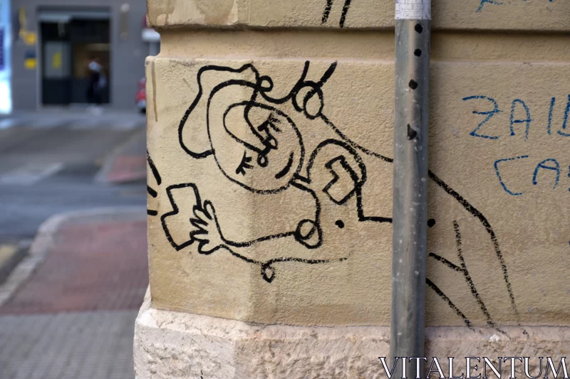 Minimalistic Graffiti Art on City Street Pole Free Stock Photo