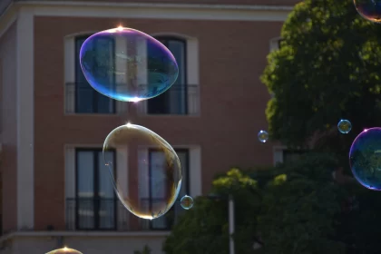 Soap Bubbles Dancing in Urban Landscape - A Light Academia Aesthetic Free Stock Photo