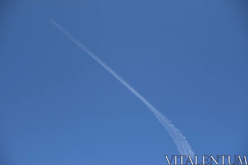 White Contrail in Blue Sky: A Study in Environmental Awareness Free Stock Photo