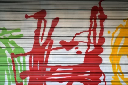 Graffiti Art on Garage Door: A Captivating Blend of Colors and Figures