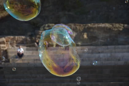 Ethereal Soap Bubbles Floating Over Sea and Coast Free Stock Photo