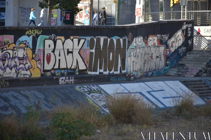 Skateboarding in Urban Playground with Graffiti Backdrop Free Stock Photo