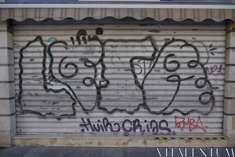 Graffiti Art on Door: An Urban Rebellion Free Stock Photo