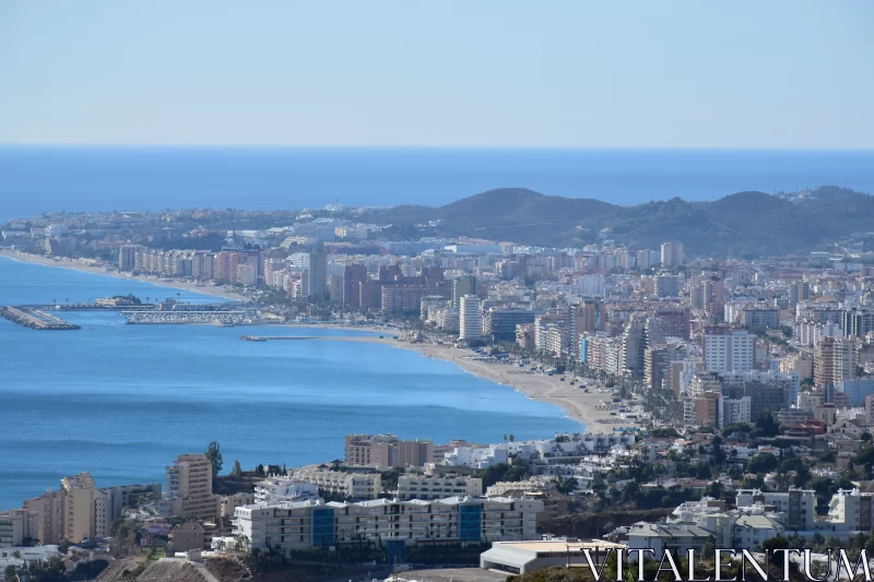 PHOTO Grandiose Cityscape View with Azure Sea and Sun-soaked Colours
