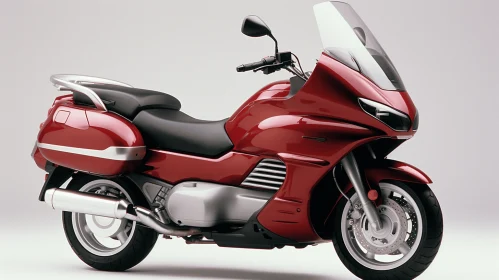 Red Motorcycle Parked on Gray Background | Streamlined Forms
