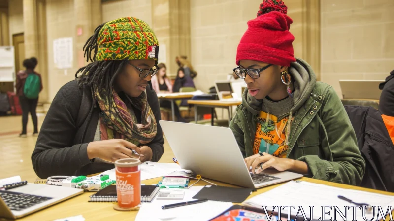 Two Young Women Sitting at a Table with a Laptop AI Image