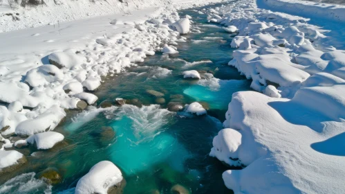 Serene Winter Landscape: River Flowing Through Snowy Valley