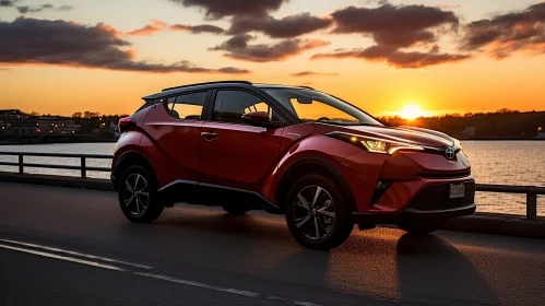 Red Toyota C-HR Compact SUV by Lake | Vehicle on Paved Road