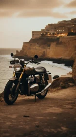 Classic Motorcycle on Cliffside Overlooking Ocean at Sunset