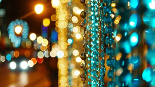 Blue and Green Beads with Blurred City Lights Background