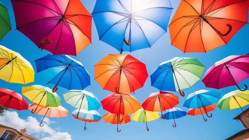 Colorful Umbrellas Against Blue Sky | Sunlight Filtering Through