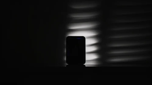 Modern Smartphone in Shadowy Light