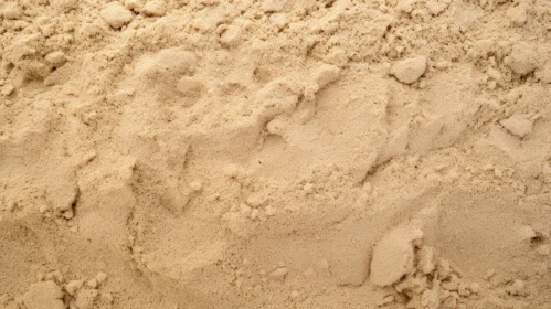 Close-up Dry Sand Texture with Footprints