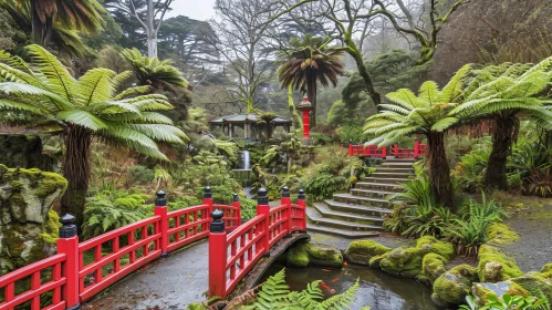 Tranquil Garden with Red Bridge and Waterfall