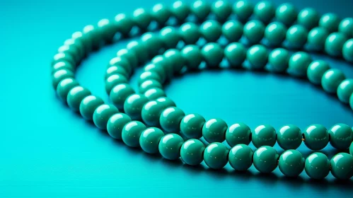 Turquoise Beads on Blue Background