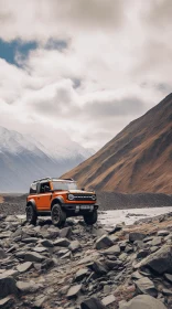 Captivating Ford Bronco on Rocky Road with Majestic Mountains