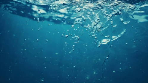 Enchanting Underwater Bubbles in Deep Blue Water